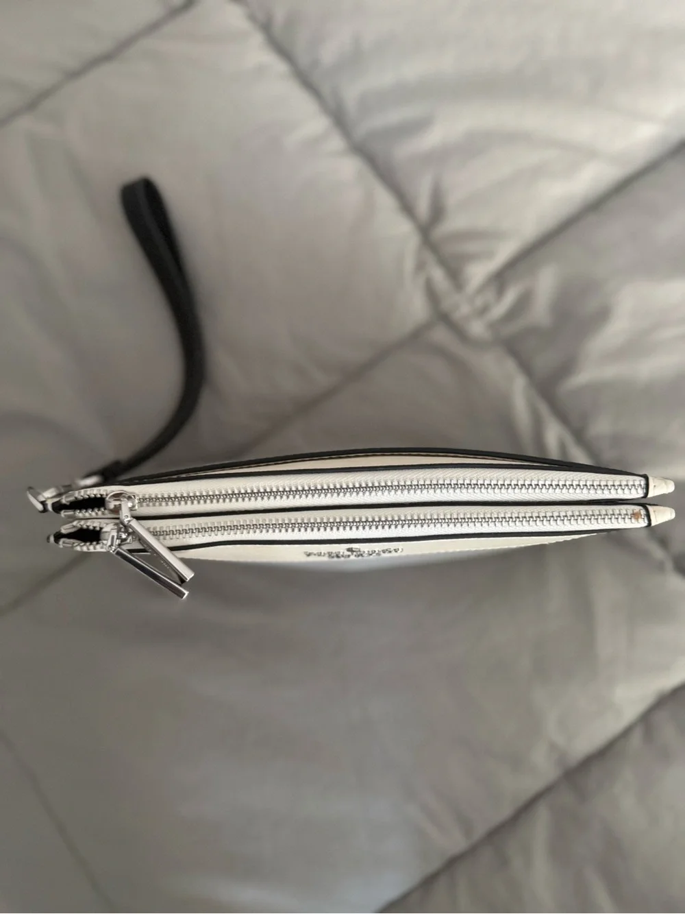 kate spade gray and cream wristlet with black strap